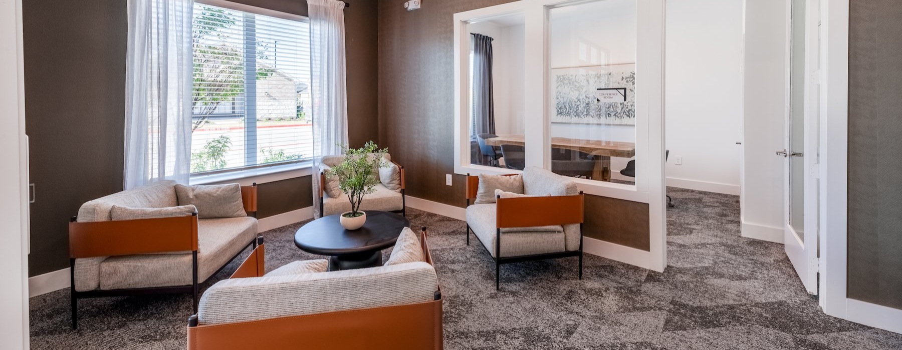 a clubroom with chairs and a coffee table