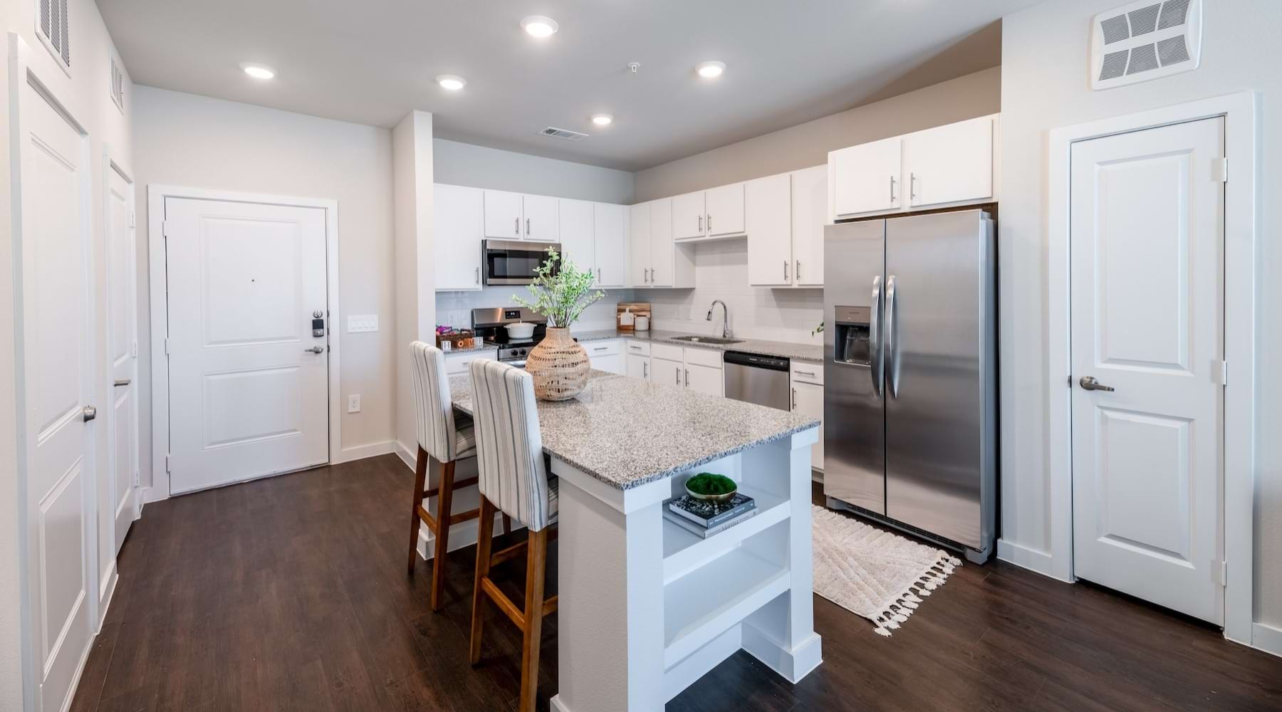 a kitchen with white cabinets